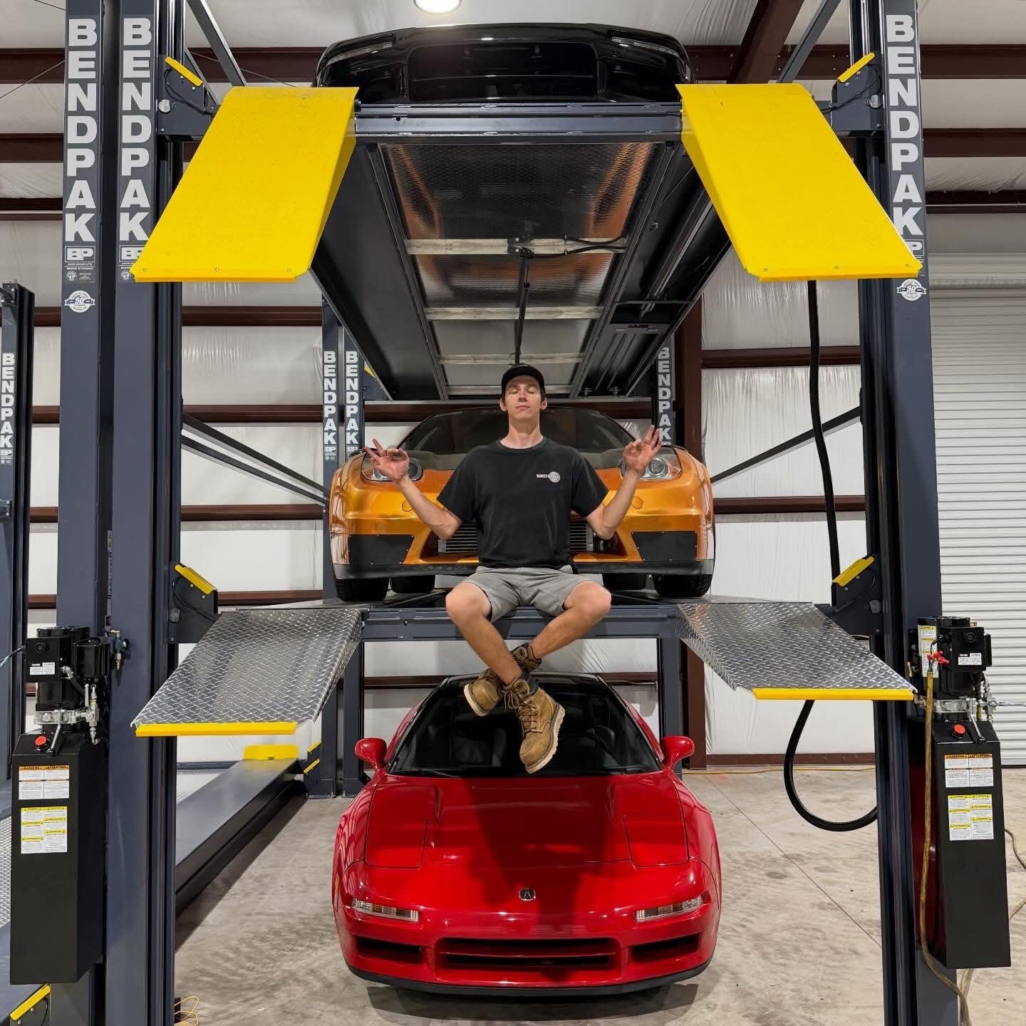 Two tier lift with vehicles